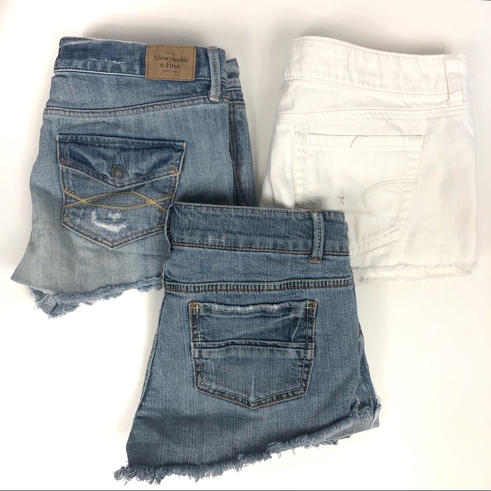 Three pair of distress jean denim shorts. …